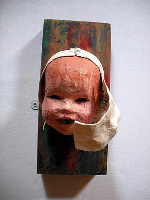 Doll's head on wooden block